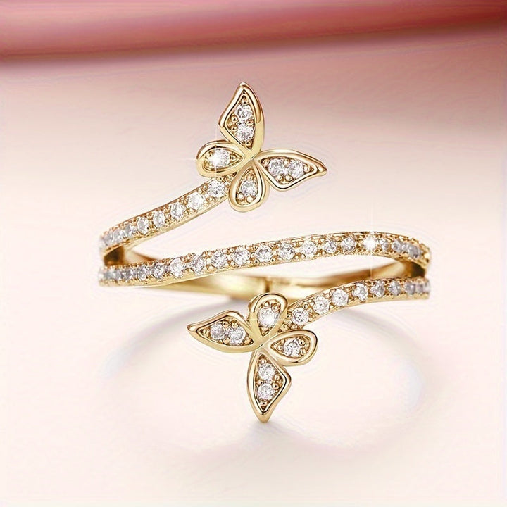 Butterfly-Embellished White Gold Ring with Zirconia Inlays