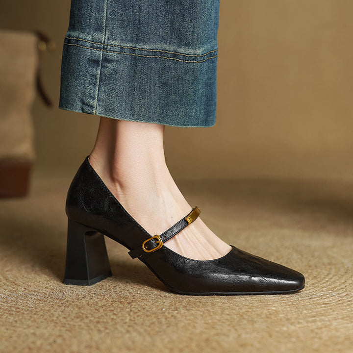 Onyx Black lambskin block pump with metallic strap, three-quarter view