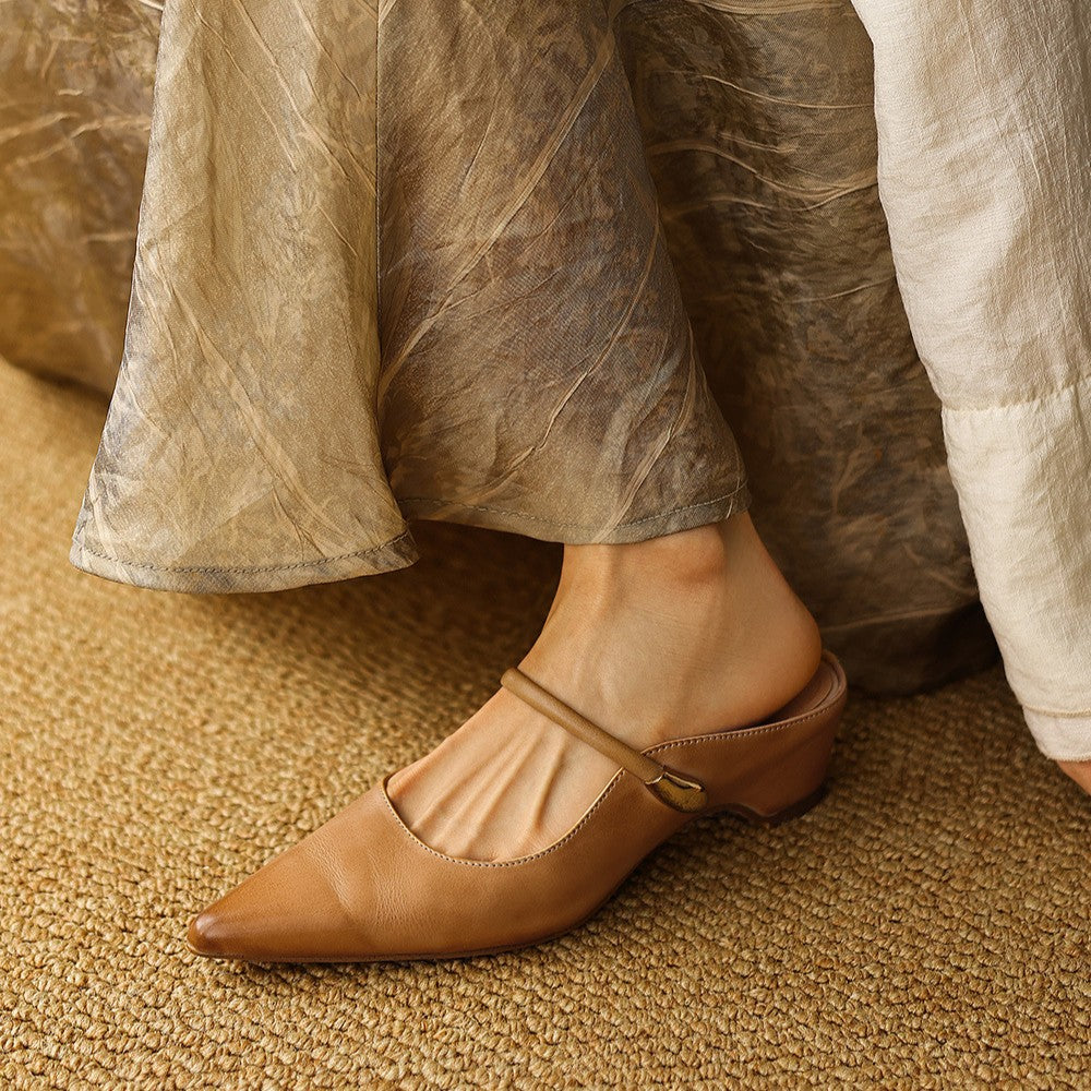Close-up of cowhide leather on a pointed mule