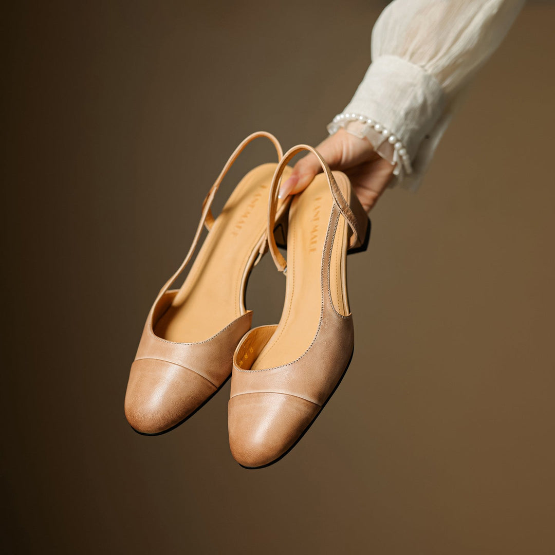 Cap-toe leather slingback heels, top view of Almond Tan pair