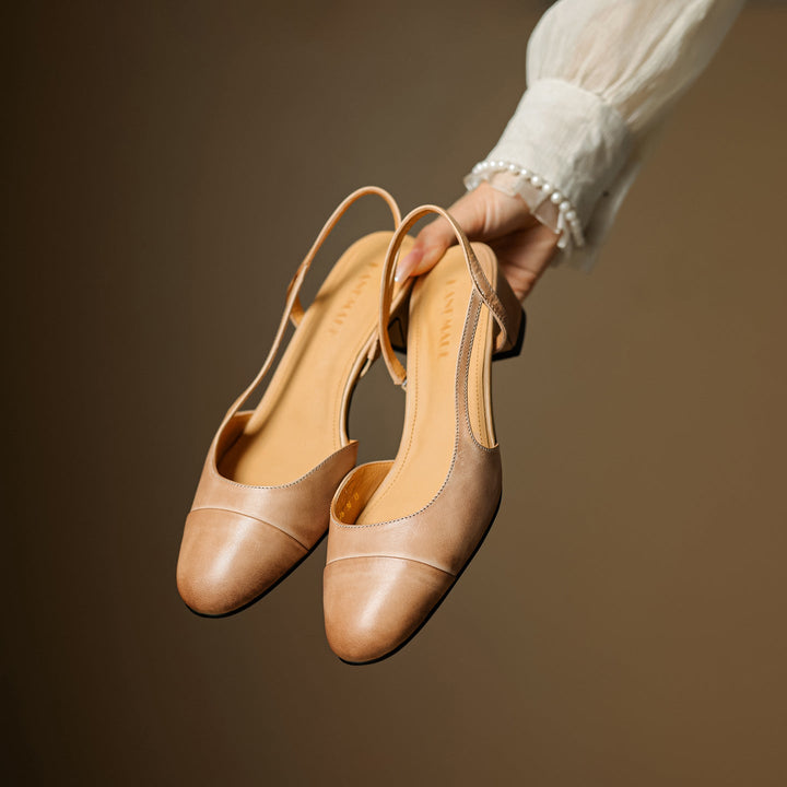 Cap-toe leather slingback heels, top view of Almond Tan pair