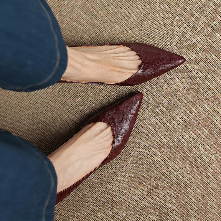 Soft Ivory lambskin pump, side view of 2.4-inch mid heel