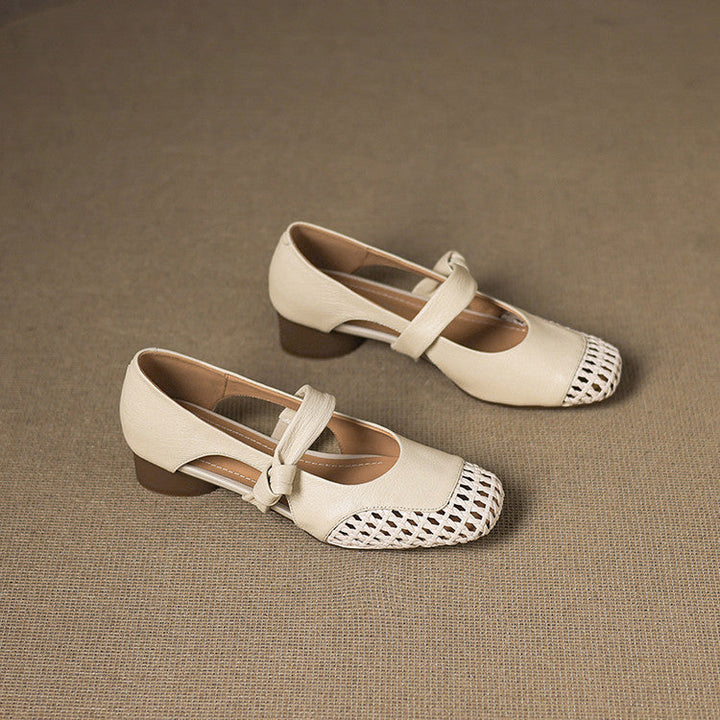 Women's woven leather Mary-Janes shown as a pair