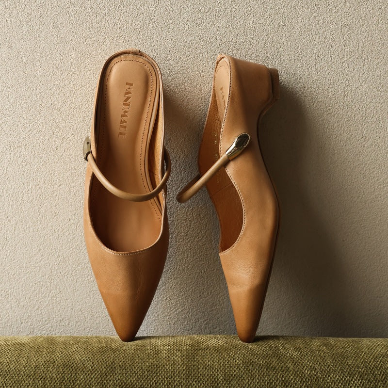 Women's pointed leather mules shown as a pair