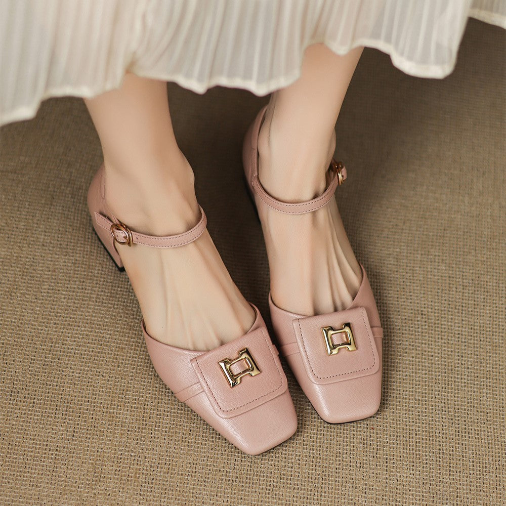 Polished buckle strap detail on a leather Mary-Jane