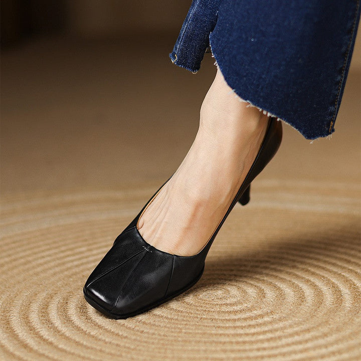 Close-up of tapered heel on Carolyn leather pumps