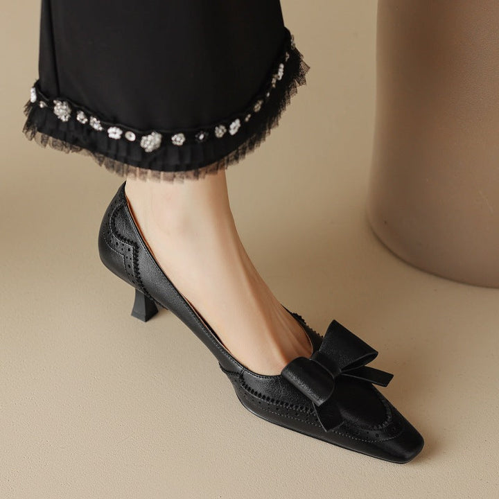 Bow leather pump, angled sculpted-heel view