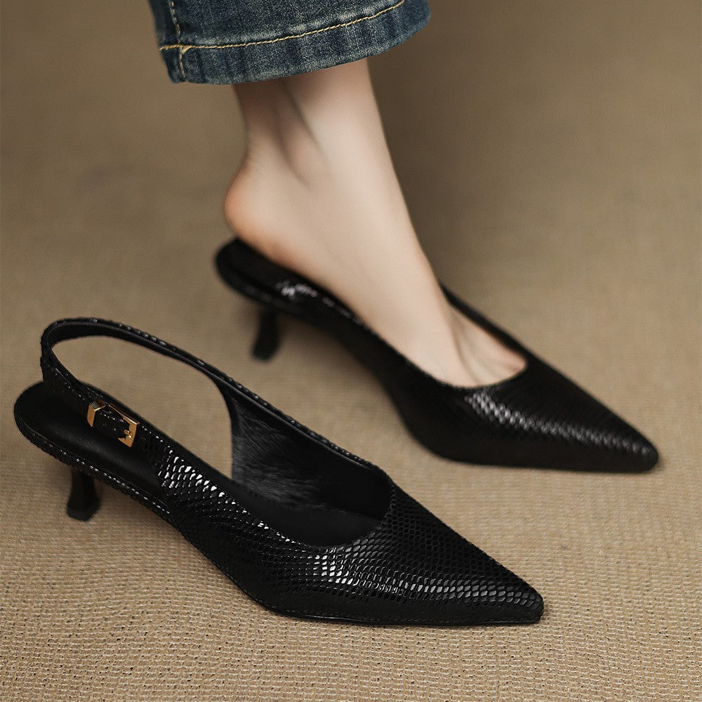 Onyx Black leather slingback heels worn with tailored trousers