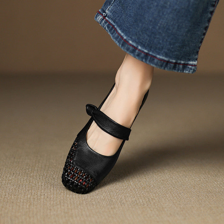 Woven toe and Mary-Jane strap detail on a leather shoe