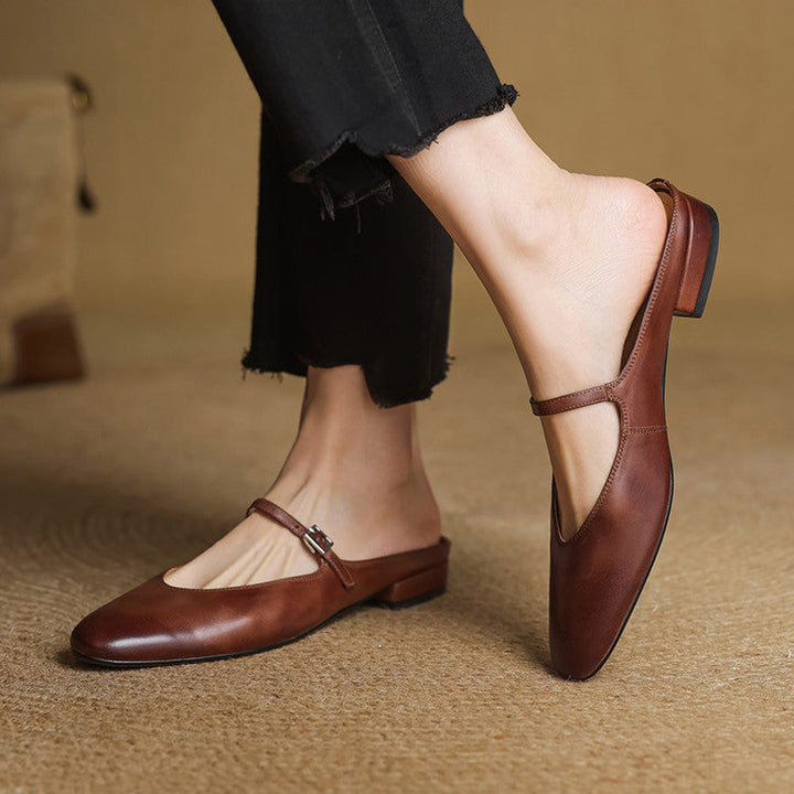 Close-up of genuine leather and buckle strap on a Mary-Jane mule