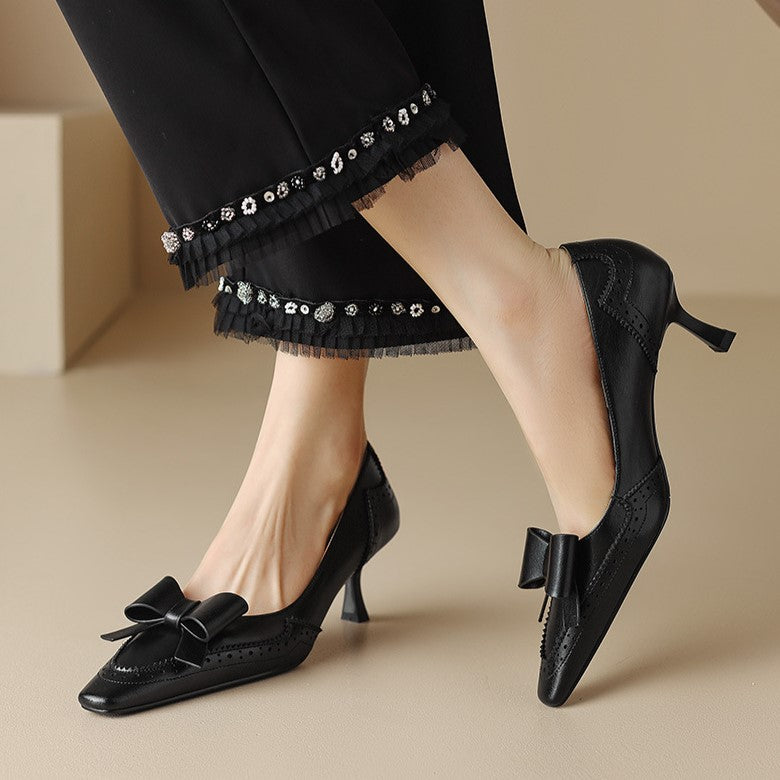 Bow leather pumps styled with a pencil skirt