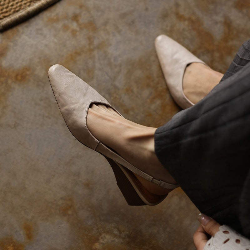 Deep Onyx leather wedge slingback, side view of 1.75-inch wedge heel