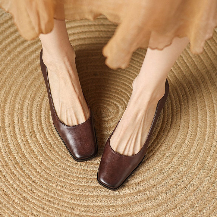 Garnet Red leather pump, side view of 2.4-inch flare heel