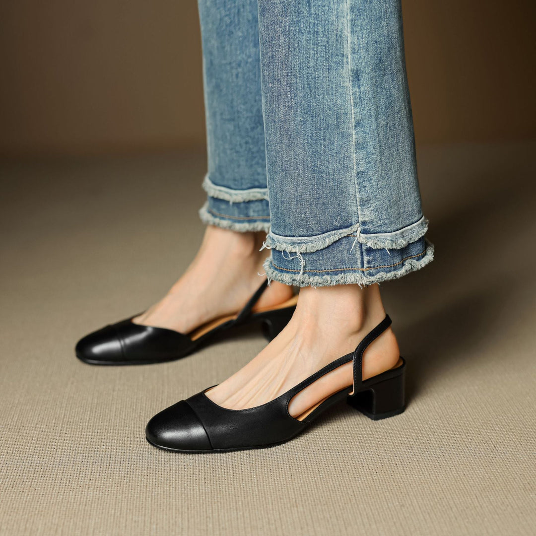 Harlow cap-toe slingbacks worn with tailored trousers