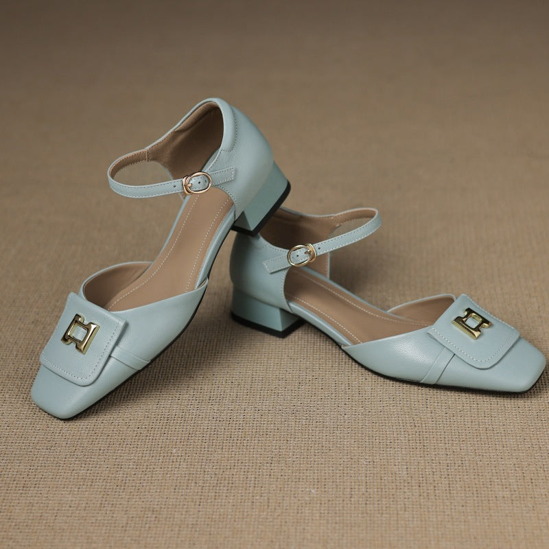 Women's buckle leather Mary-Janes shown as a pair