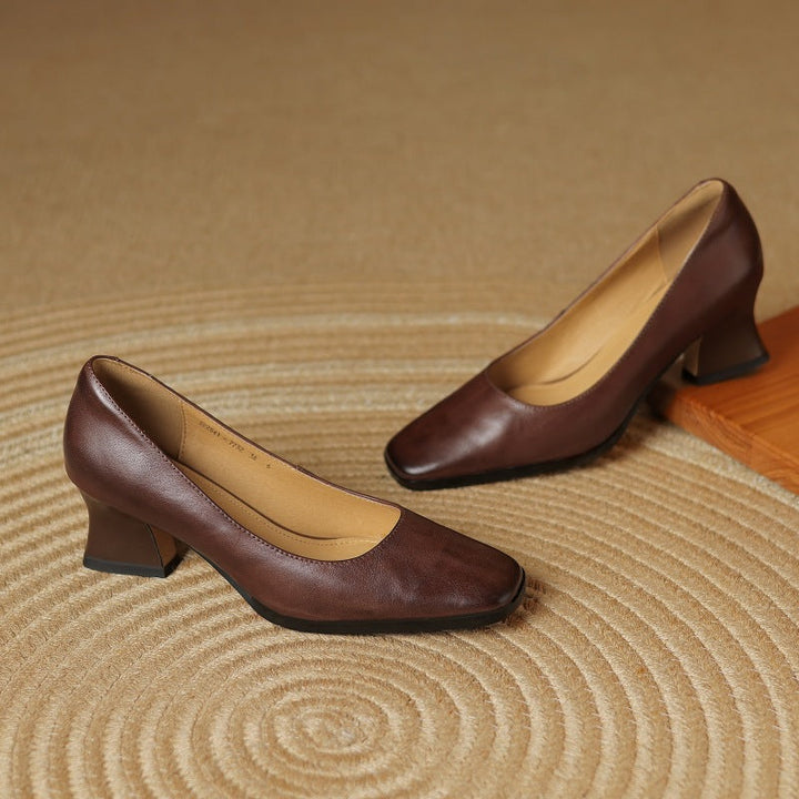Square-toe flare-heel leather pumps, top view of Espresso Brown pair