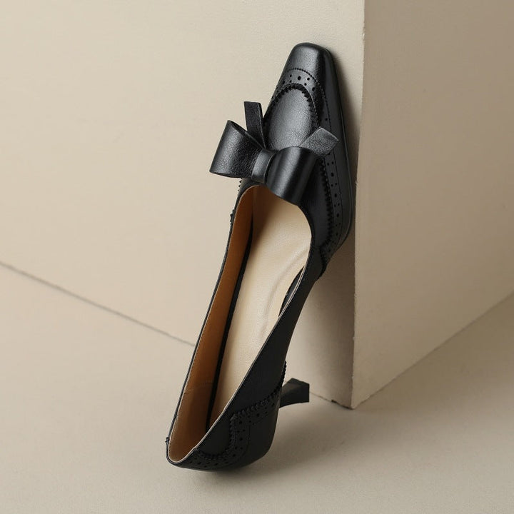 Women's bow leather pumps, front view