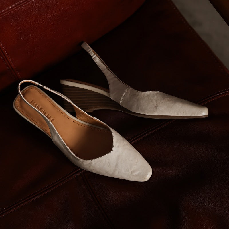 Lucille black wedge slingbacks, back view showing slingback strap