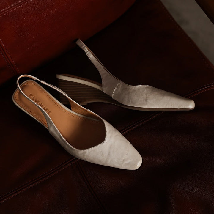 Lucille black wedge slingbacks, back view showing slingback strap