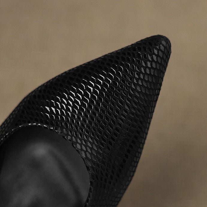 Onyx Black pointed slingback heels, angled studio shot