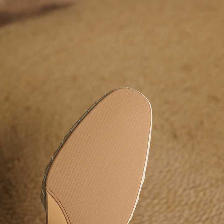 Champagne Gold woven leather ankle-strap heels, angled studio shot