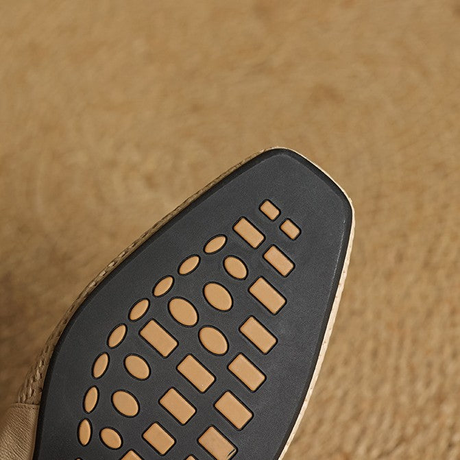 Noir Black perforated leather heels, angled studio shot