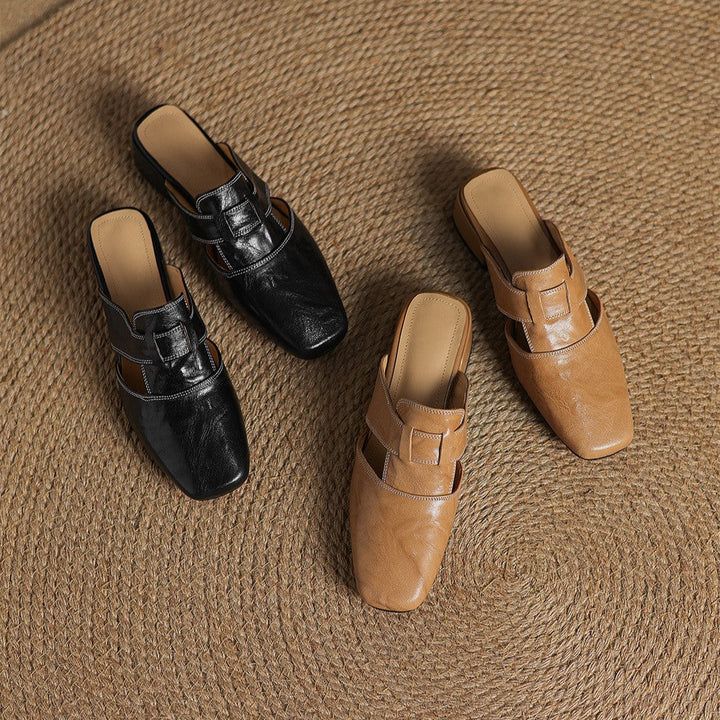Square-toe leather mules styled with ankle trousers
