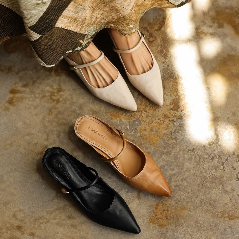 Pointed leather mules styled with cropped trousers