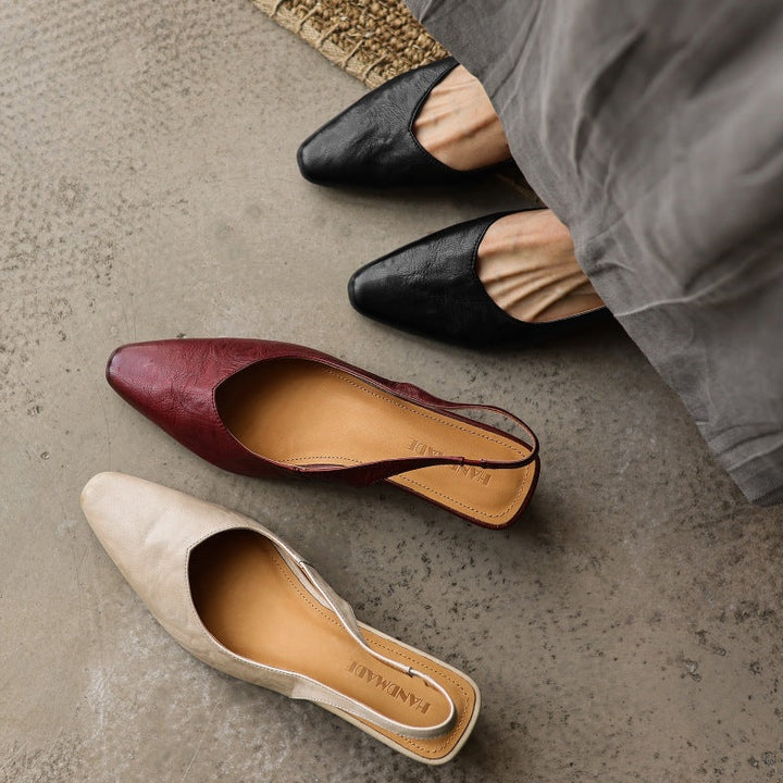 Round-toe leather wedge slingbacks, top view of Soft Oat pair