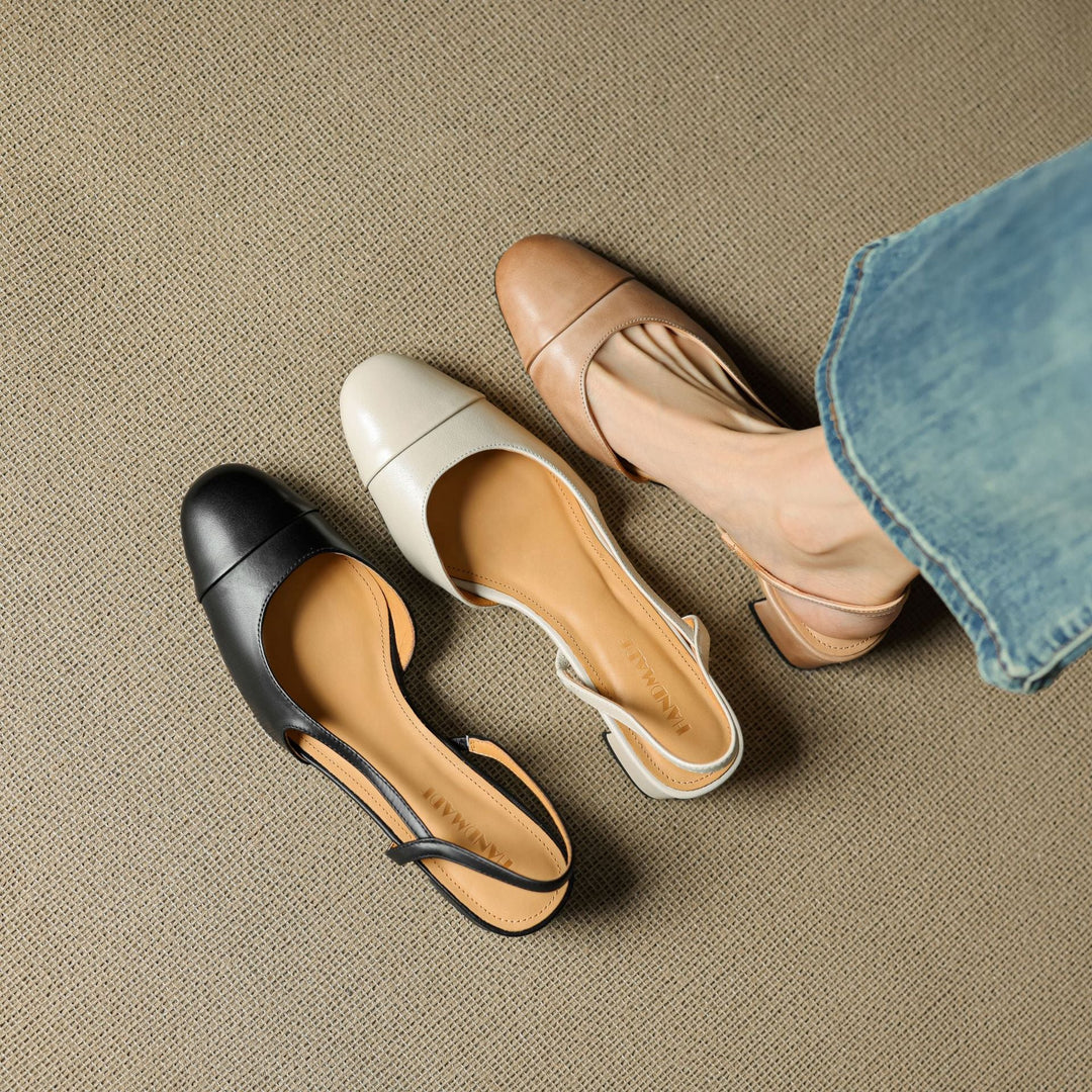 Ivory Cream leather slingback heels, angled studio shot