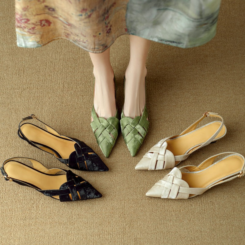 Low 1.5-inch heel of a woven leather slingback, angled view