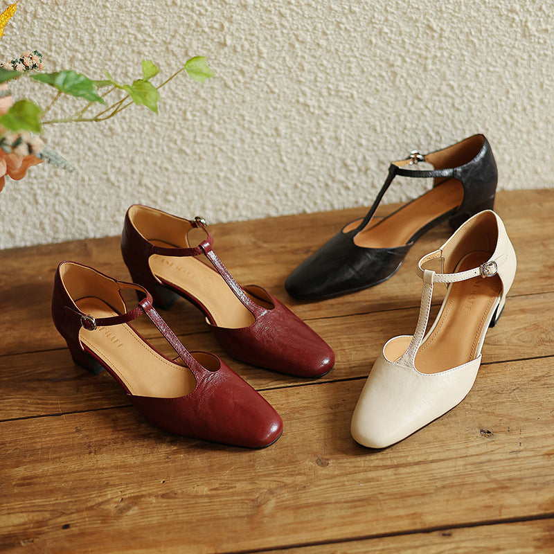 Women's leather T-strap heels shown as a pair