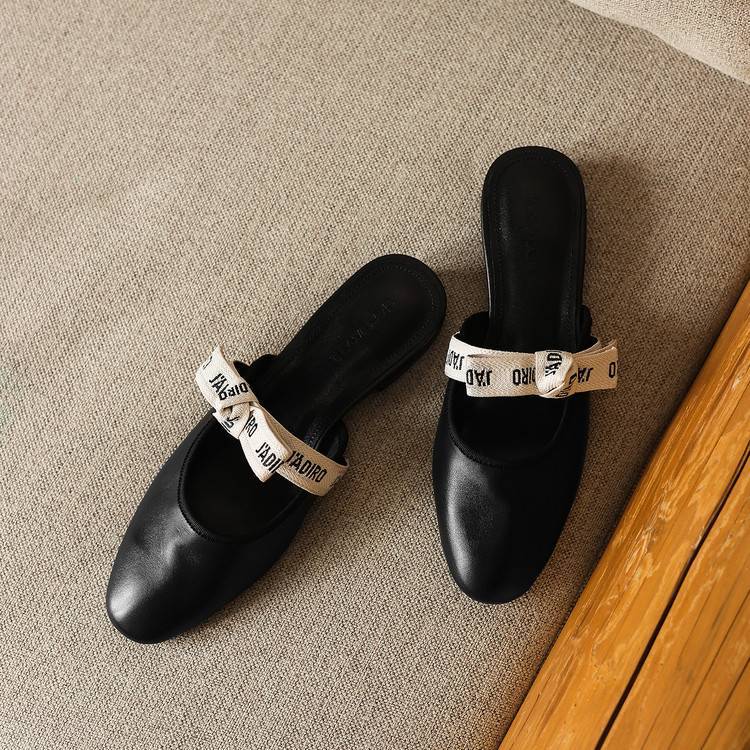 Adele mules, detail of rounded almond toe