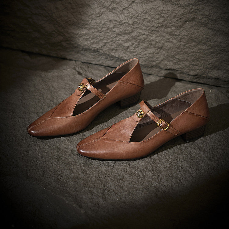 Noir Black leather T-strap pumps, angled studio shot
