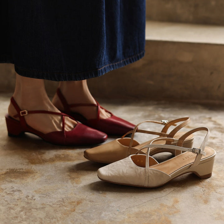 Women's cross-strap leather slingback heels shown as a pair