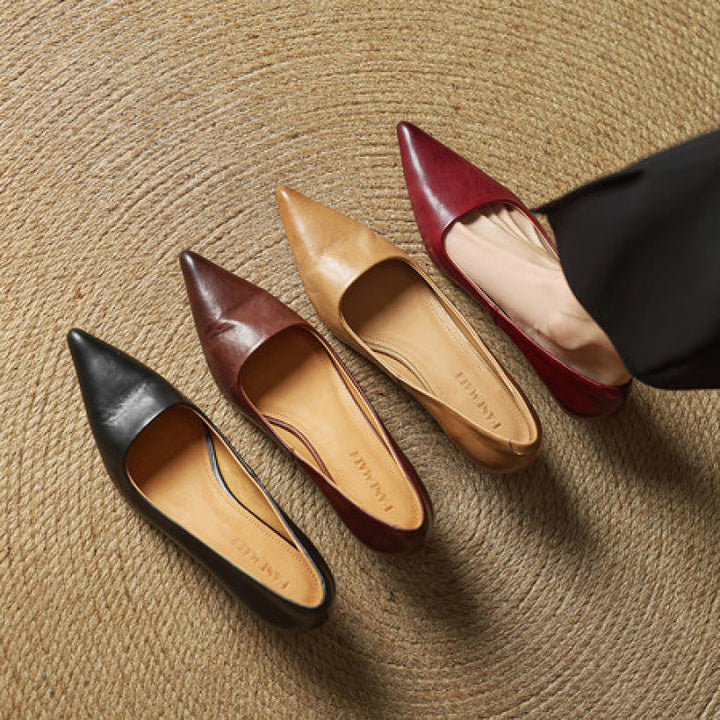 Women's leather kitten heel pumps shown as a pair