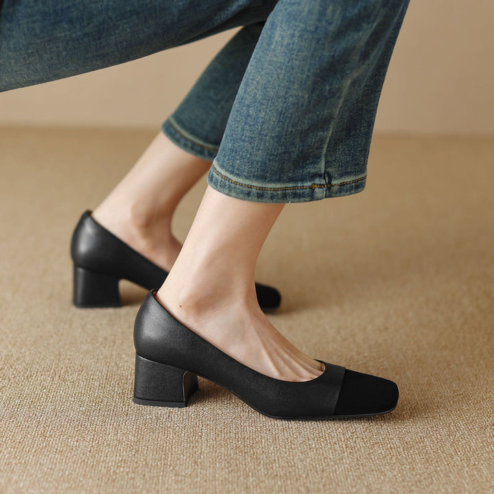 Close-up of block heel on Roberta leather pumps