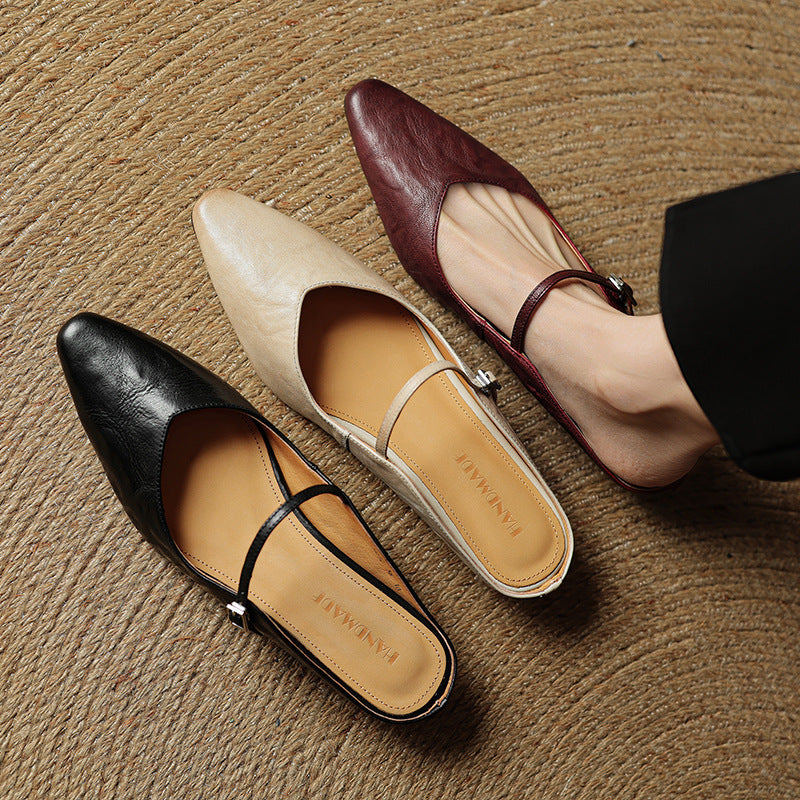 Round-toe leather flat mules, top view of Sand Beige pair