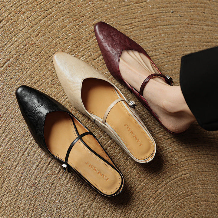 Round-toe leather flat mules, top view of Sand Beige pair