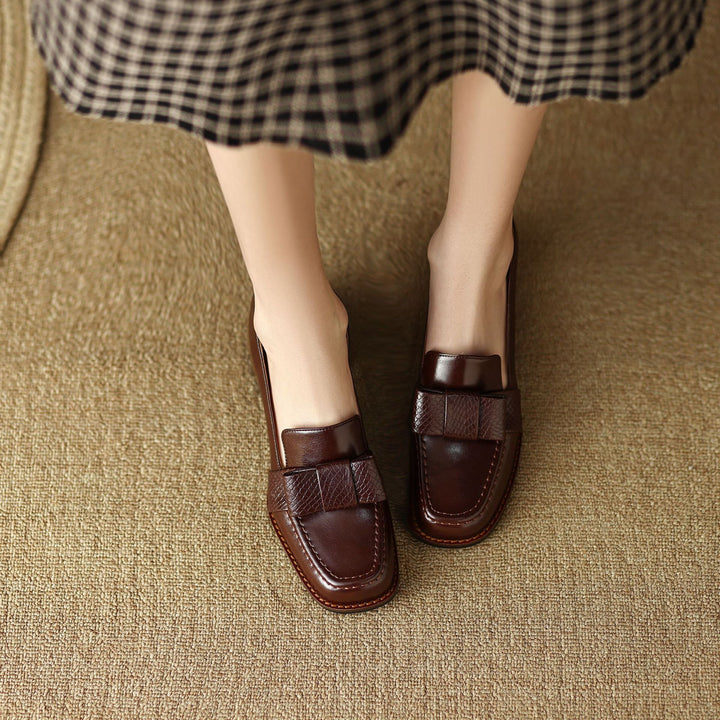 Top-down view of a square-toe bow leather loafer pump