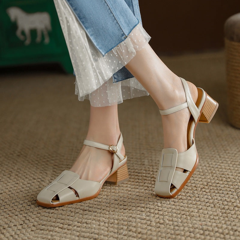 Ivory Cream cutout leather heels, angled studio shot