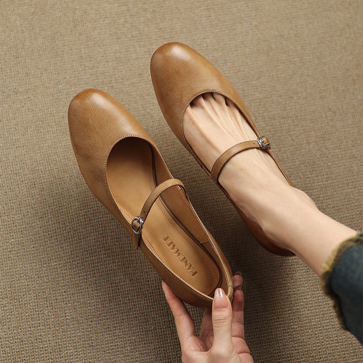 Women's pointed leather block heels shown as a pair
