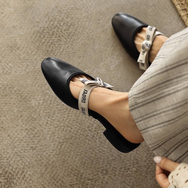 Ivory Cream leather mule, side view of low block sole