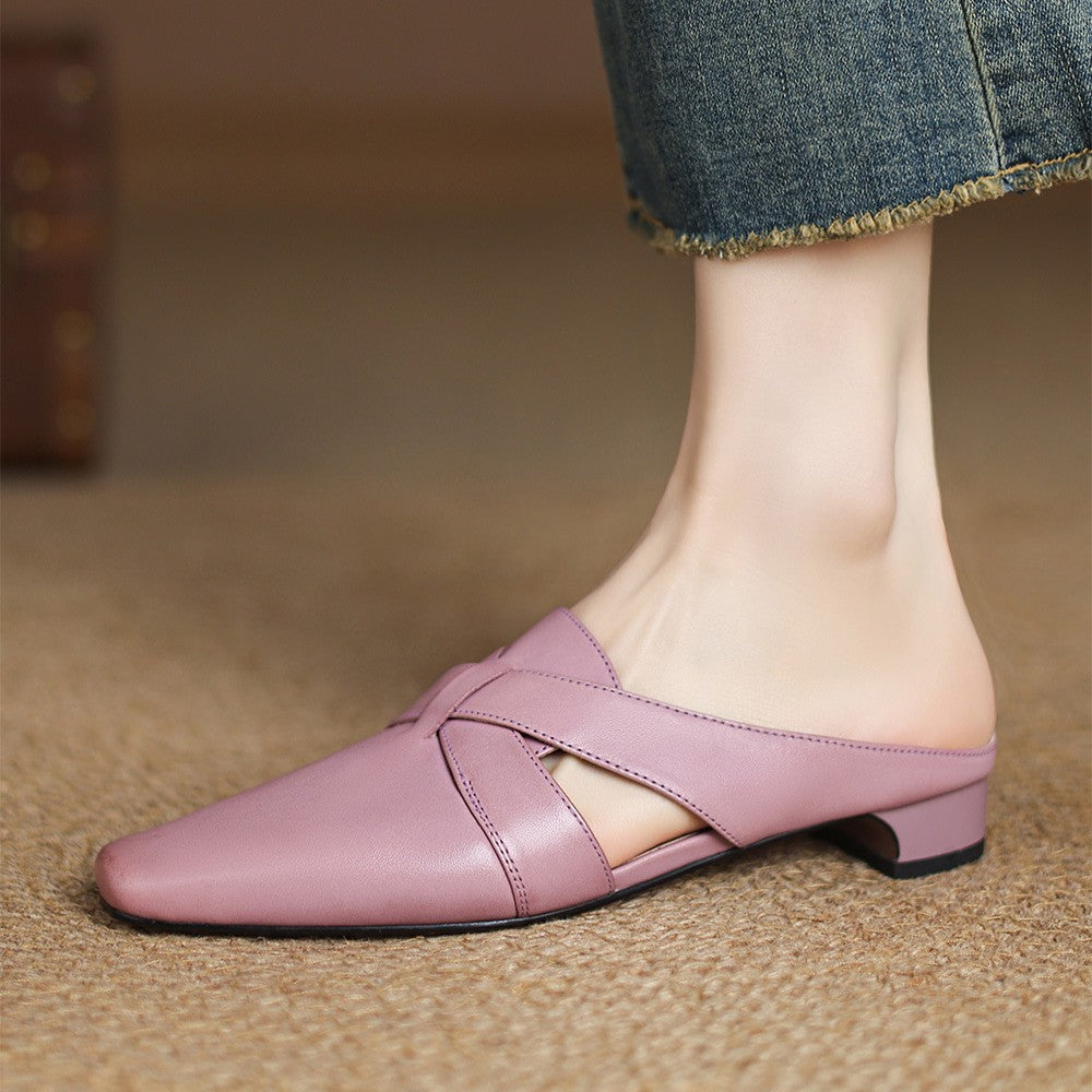 Carmen mules, close-up of sculpted cross-strap