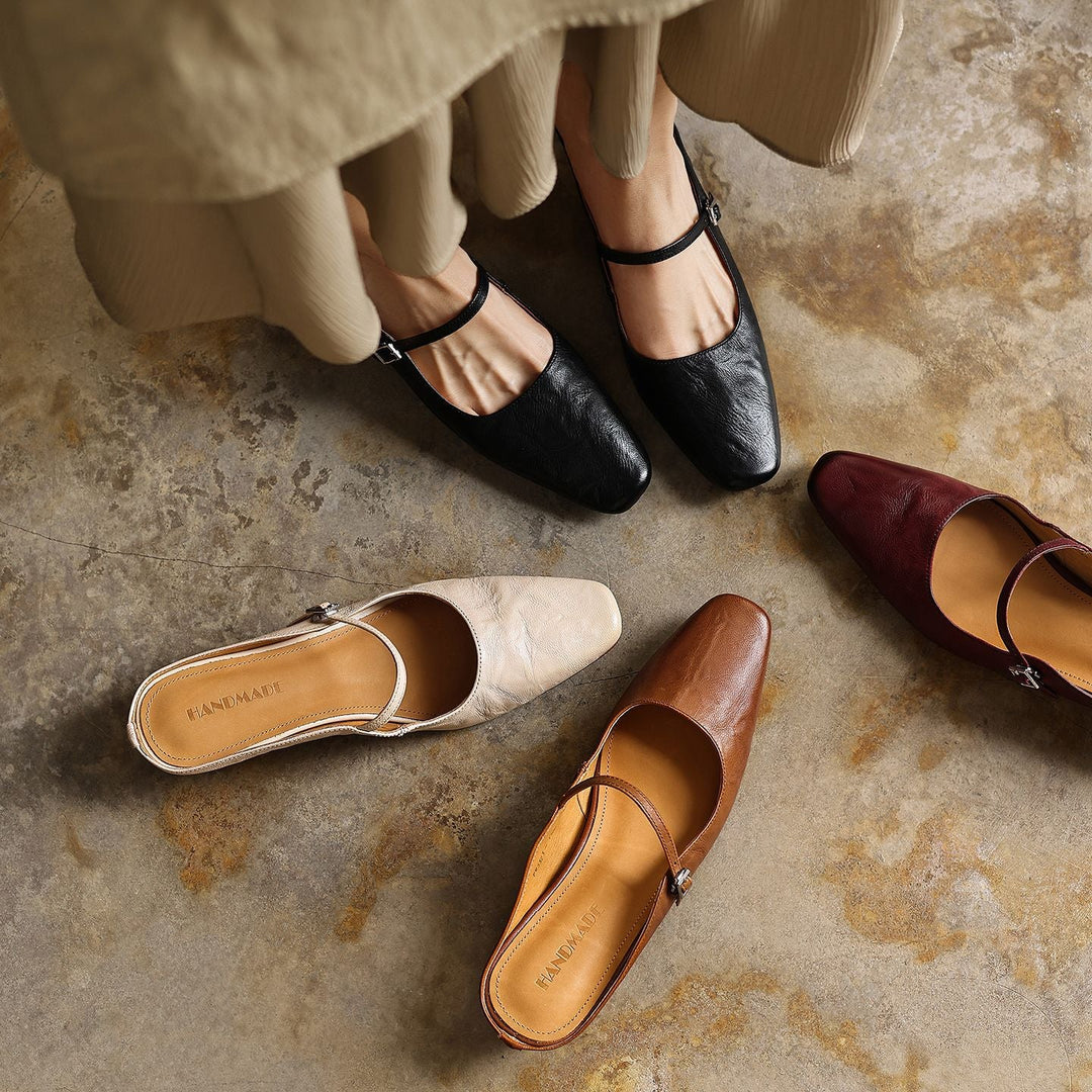 Square-toe leather heeled mules styled with tailored trousers