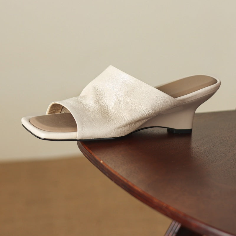 Gloria wedge mules, detail of wide sculpted vamp