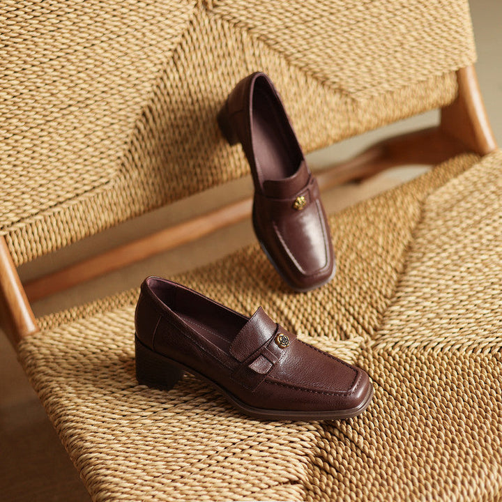 Square-toe leather loafer pumps, top view of Cocoa Brown pair