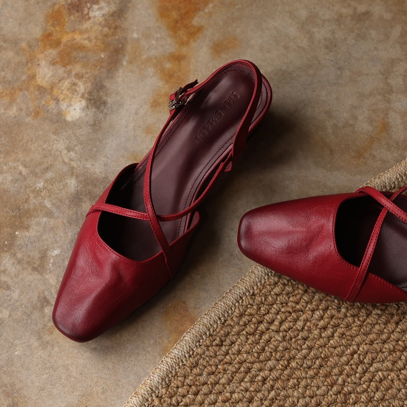 Cross-strap leather slingback, back view showing the buckle strap