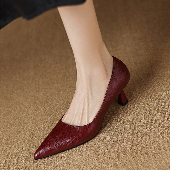 Ivory Creme lambskin pump, side view of 2.5-inch slim heel