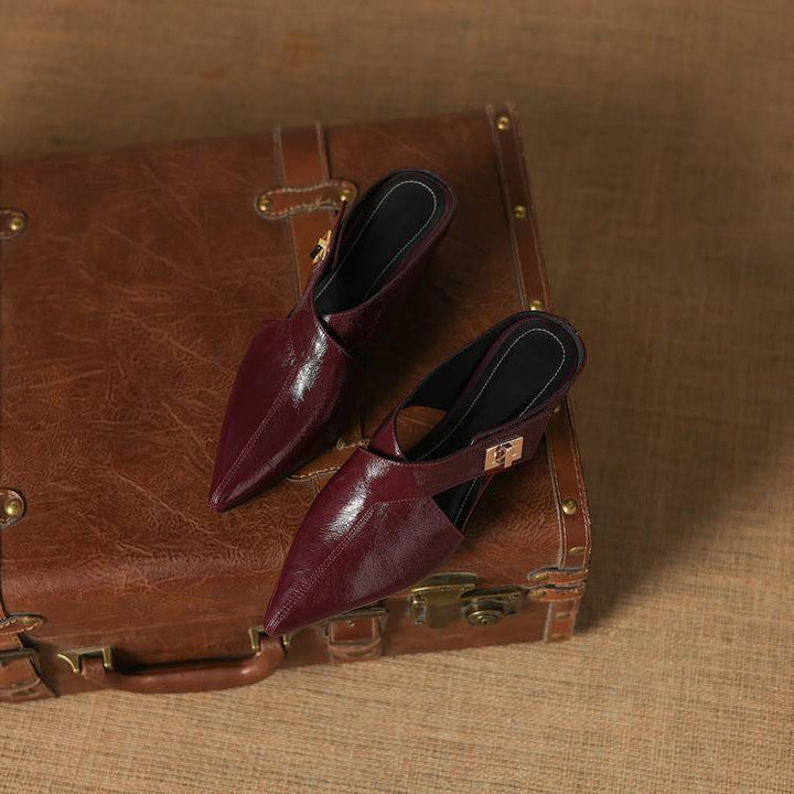 Top-down view of an elongated pointed leather mule